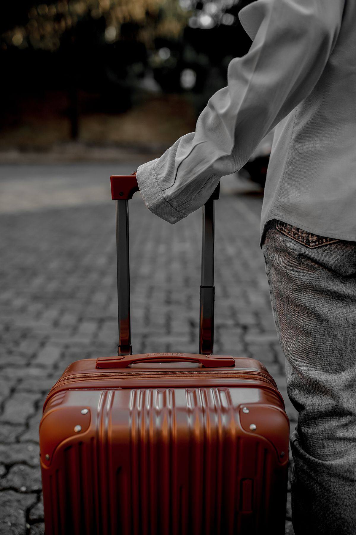 A rolling suitcase, ready to go